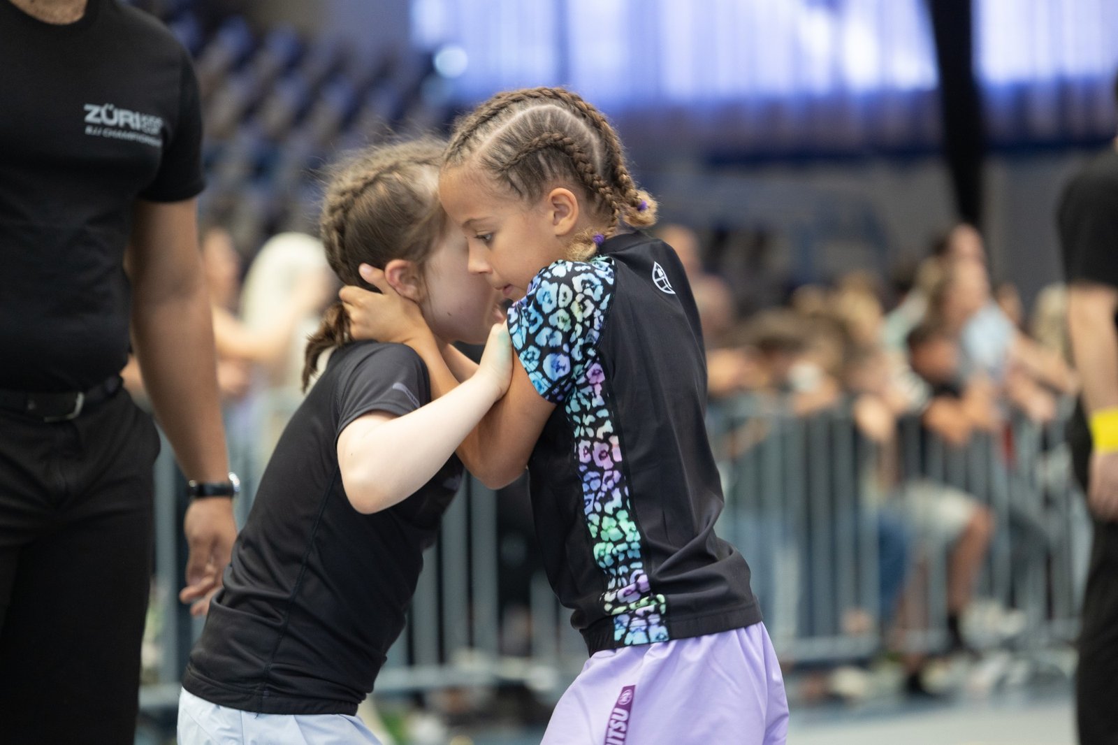 Aleyna, in a leopard-print rashguard, fighting for grips in her No-Gi match at the Züri Kids Cup BJJ Championship 2026.